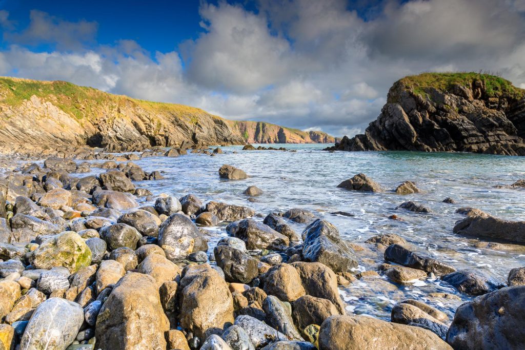 Around the corner from Stackpole Quay, a rocky beach opens towards the Pembrokeshire coast, Wales – view 2