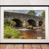 The ancient stone bridge at Postbridge spans the East Dart River in the centre of Dartmoor