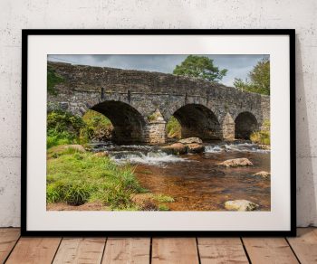 The ancient stone bridge at Postbridge spans the East Dart River in the centre of Dartmoor