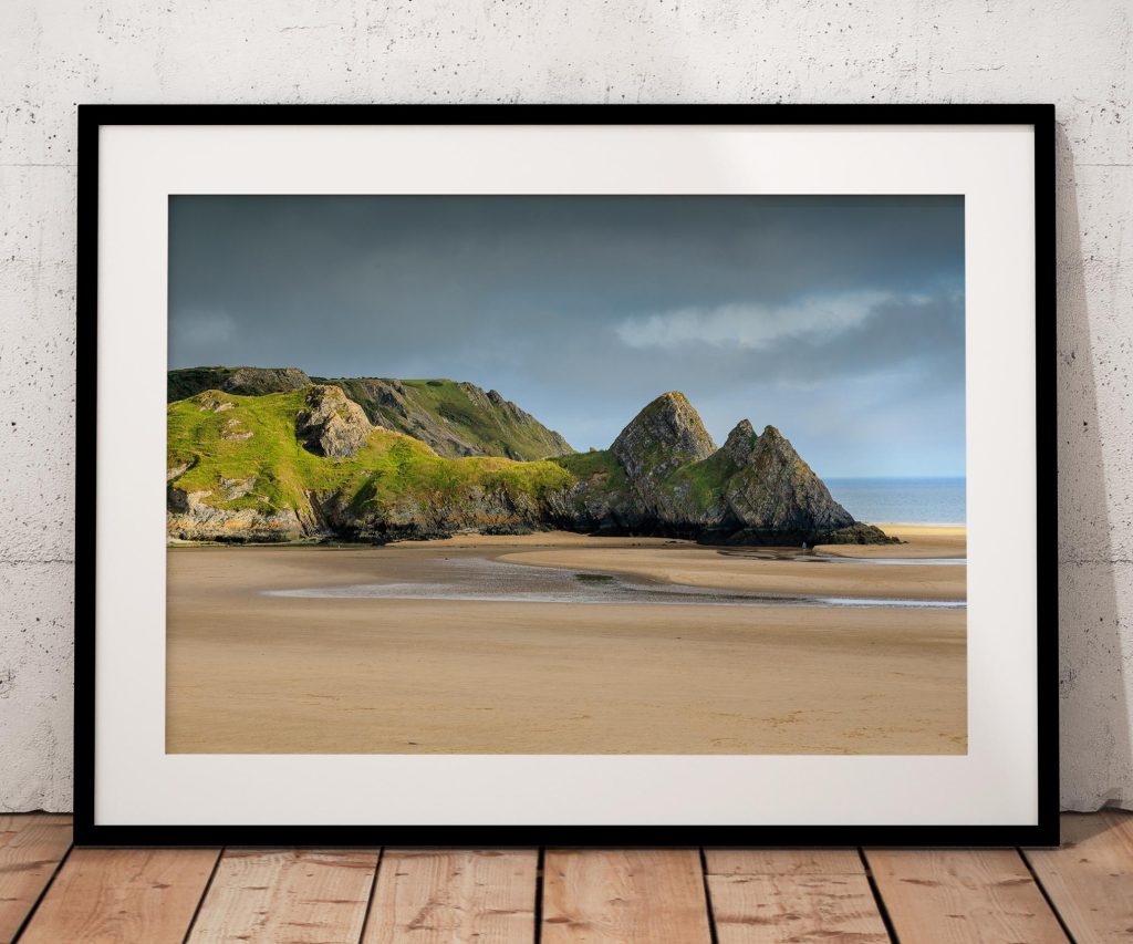 Three Cliffs Bay on the Gower Peninsula is captured in late-afternoon light