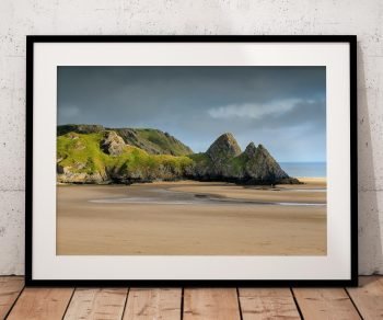 Three Cliffs Bay on the Gower Peninsula is captured in late-afternoon light