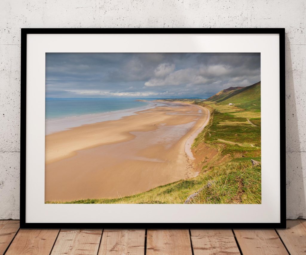 Rhossili Bay opens out in a wide sweep of sand along the Gower Peninsula