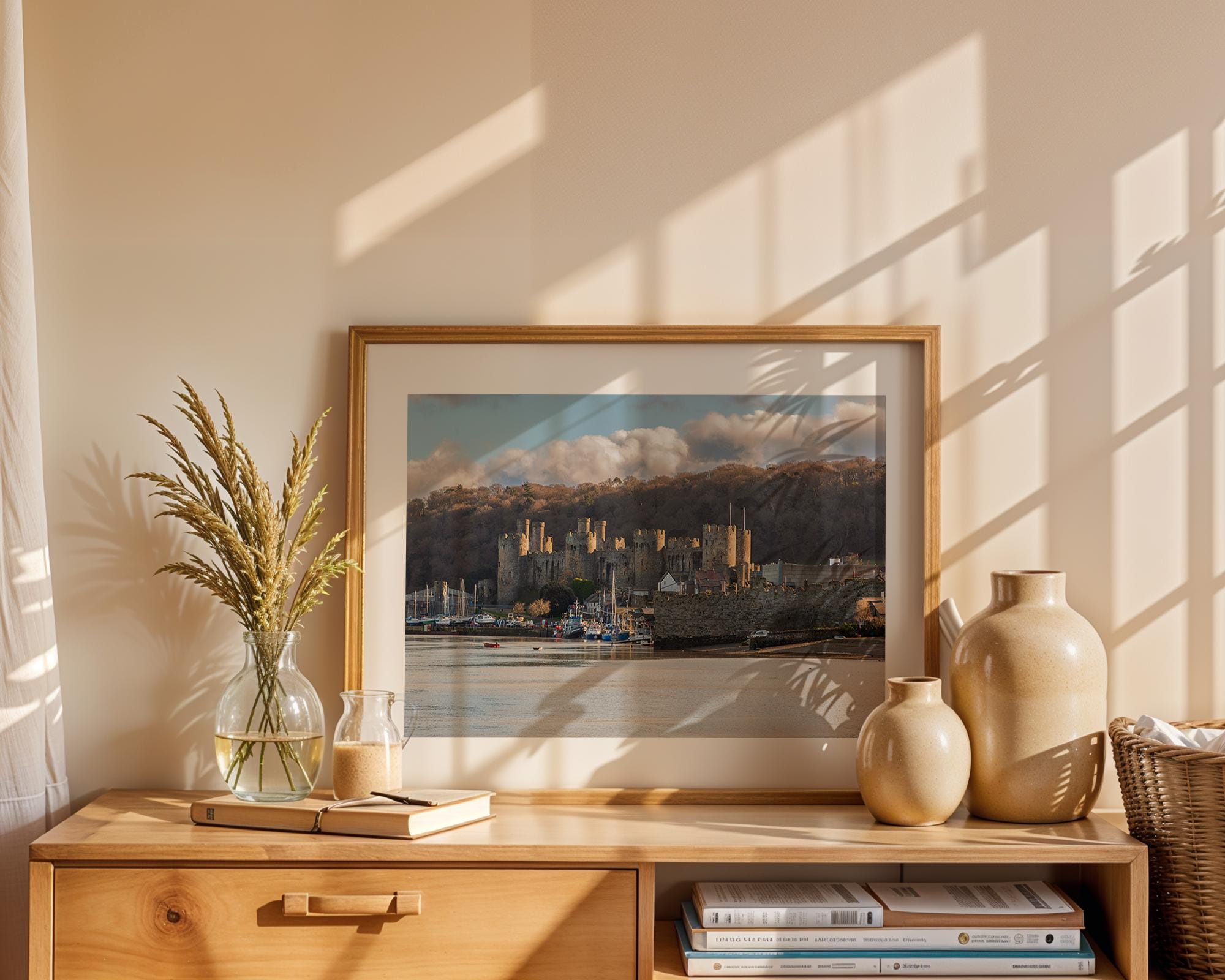 As the sun falls, warm light catches the walls and towers of Conwy Castle, North Wales – view 5