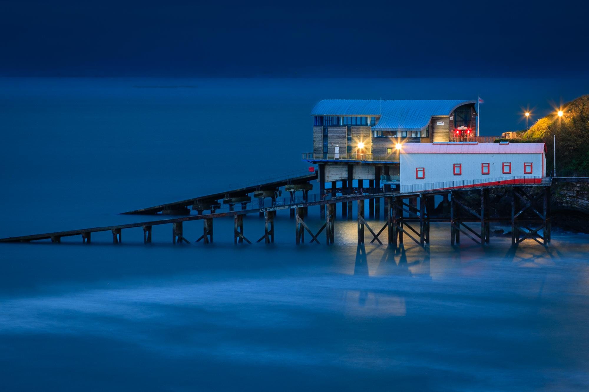 The former Tenby Lifeboat Station stands above the harbour as evening settles over Pembrokeshire, Wales – view 2