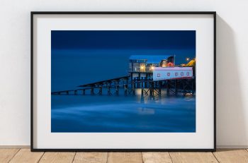 The former Tenby Lifeboat Station stands above the harbour as evening settles over Pembrokeshire, Wales