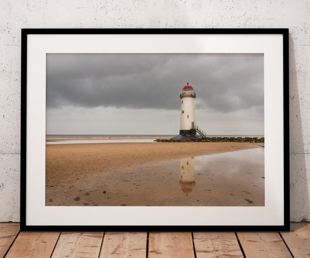 Talacre Lighthouse rises from the shoreline at Point of Ayr, North Wales