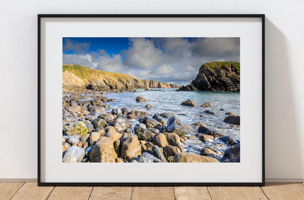 Around the corner from Stackpole Quay, a rocky beach opens towards the Pembrokeshire coast, Wales