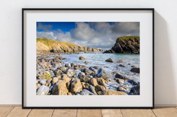 Around the corner from Stackpole Quay, a rocky beach opens towards the Pembrokeshire coast, Wales