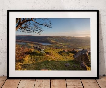 A bench looks across Macclesfield Forest towards Trentabank Reservoir, Peak District