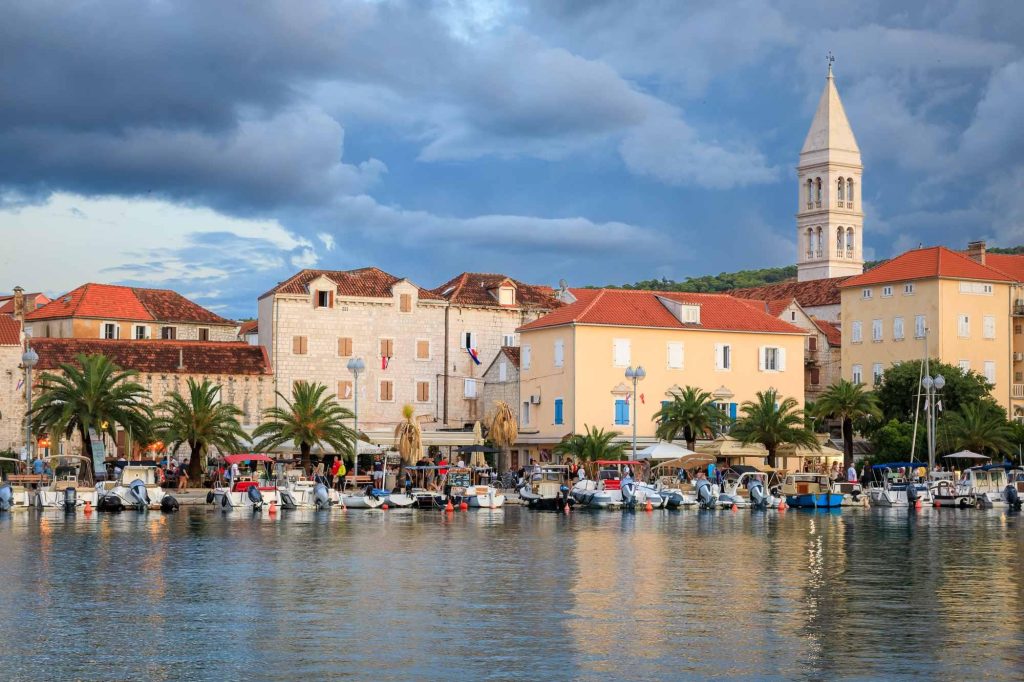 Evening light settles over Postira marina on the island of Brac, Croatia – view 2