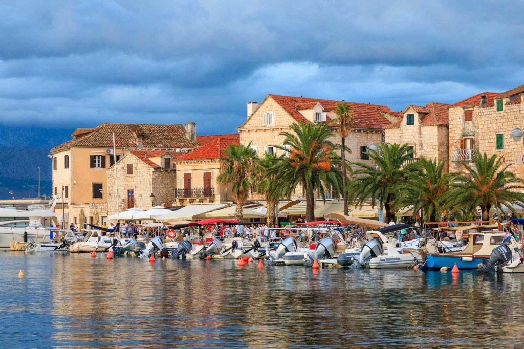 Postira’s waterfront rests in evening light on the Croatian island of Brac, Croatia – view 2