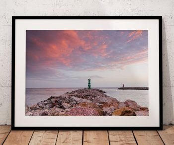 The harbour entrance at Vilamoura is silhouetted against a glowing evening sky in this coastal photograph