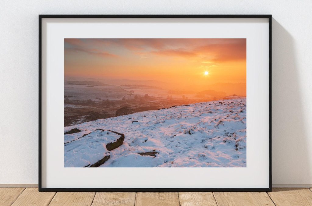 The winter sun hangs low over Bakestonedale Moor, Peak District