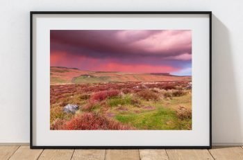 Stanage Edge rises above the Derbyshire moors beneath a remarkable April sunset