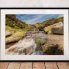 Water rushes over the rocks of the River Dane at Three Shires Head, Peak District