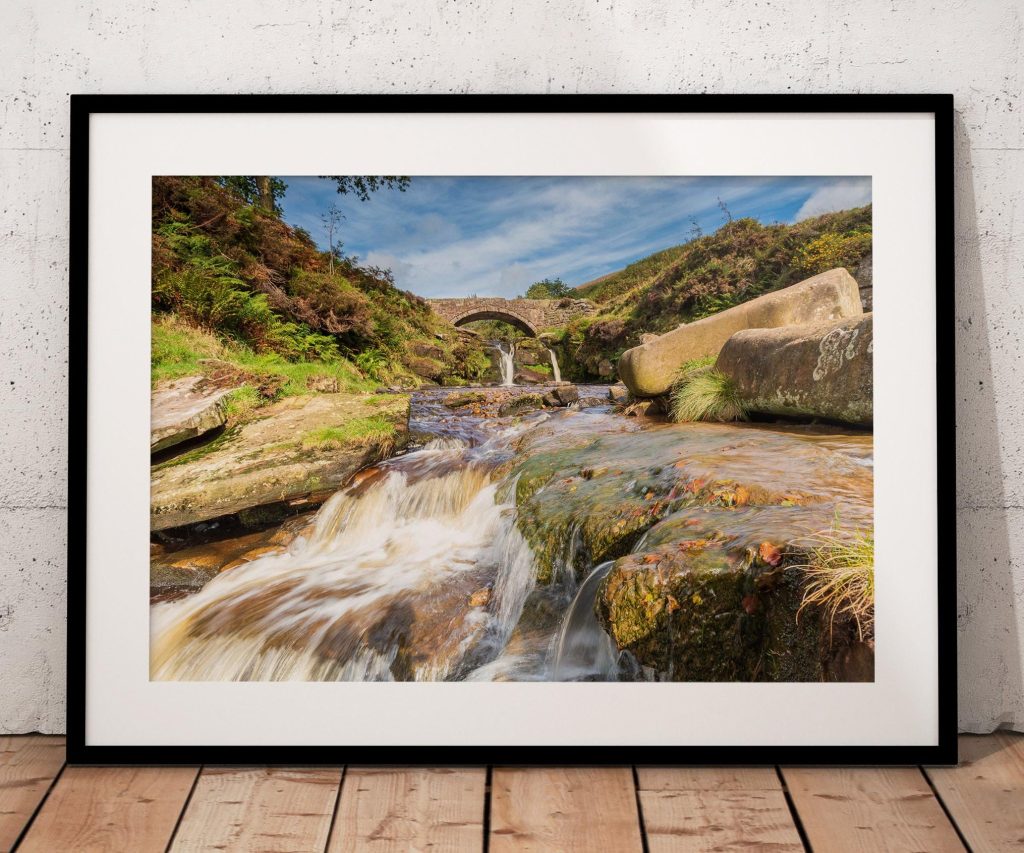 Water rushes over the rocks of the River Dane at Three Shires Head, Peak District