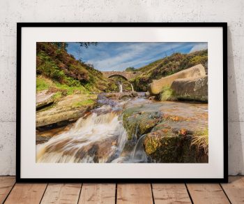 Water rushes over the rocks of the River Dane at Three Shires Head, Peak District