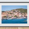 The harbour of La Maddalena is filled with boats in this bright coastal view of the town on the island of Maddalena
