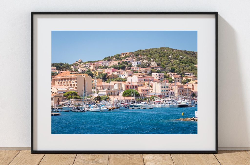 The harbour of La Maddalena is filled with boats in this bright coastal view of the town on the island of Maddalena