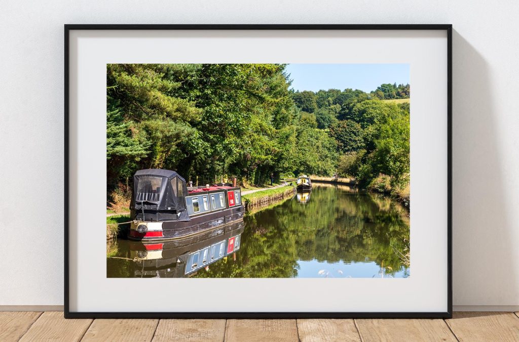 A narrowboat rests beside the Macclesfield Canal at Sutton, Peak District