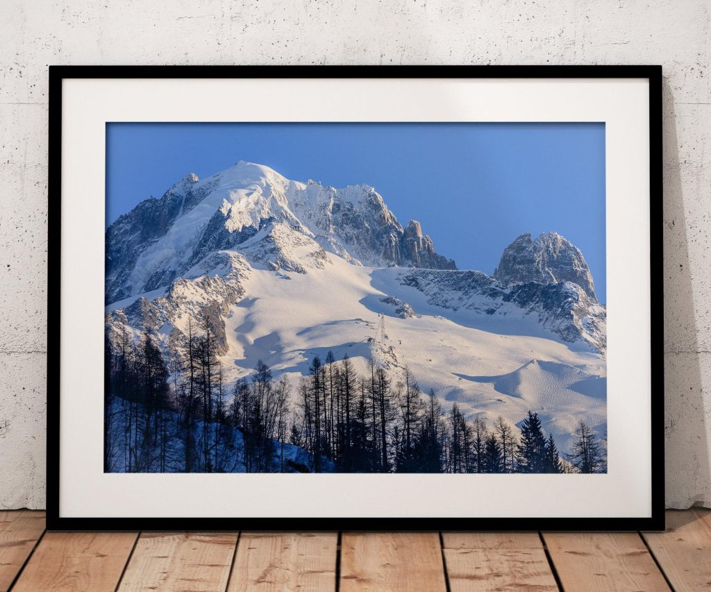 The Grand Montets and Aiguille Verte rise above Argentière in a crisp winter view of the Chamonix valley, France