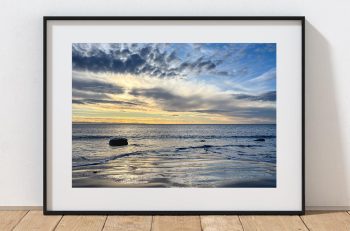 The sun settles over the Bristol Channel near Nash Point and Marcross, Wales