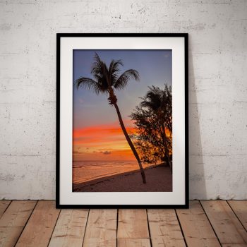 The sun sets beyond the Caribbean Sea at the Coconut Court Hotel in Hastings, Barbados