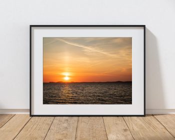 A golden summer sunset settles over the Pembrokeshire coast, Wales